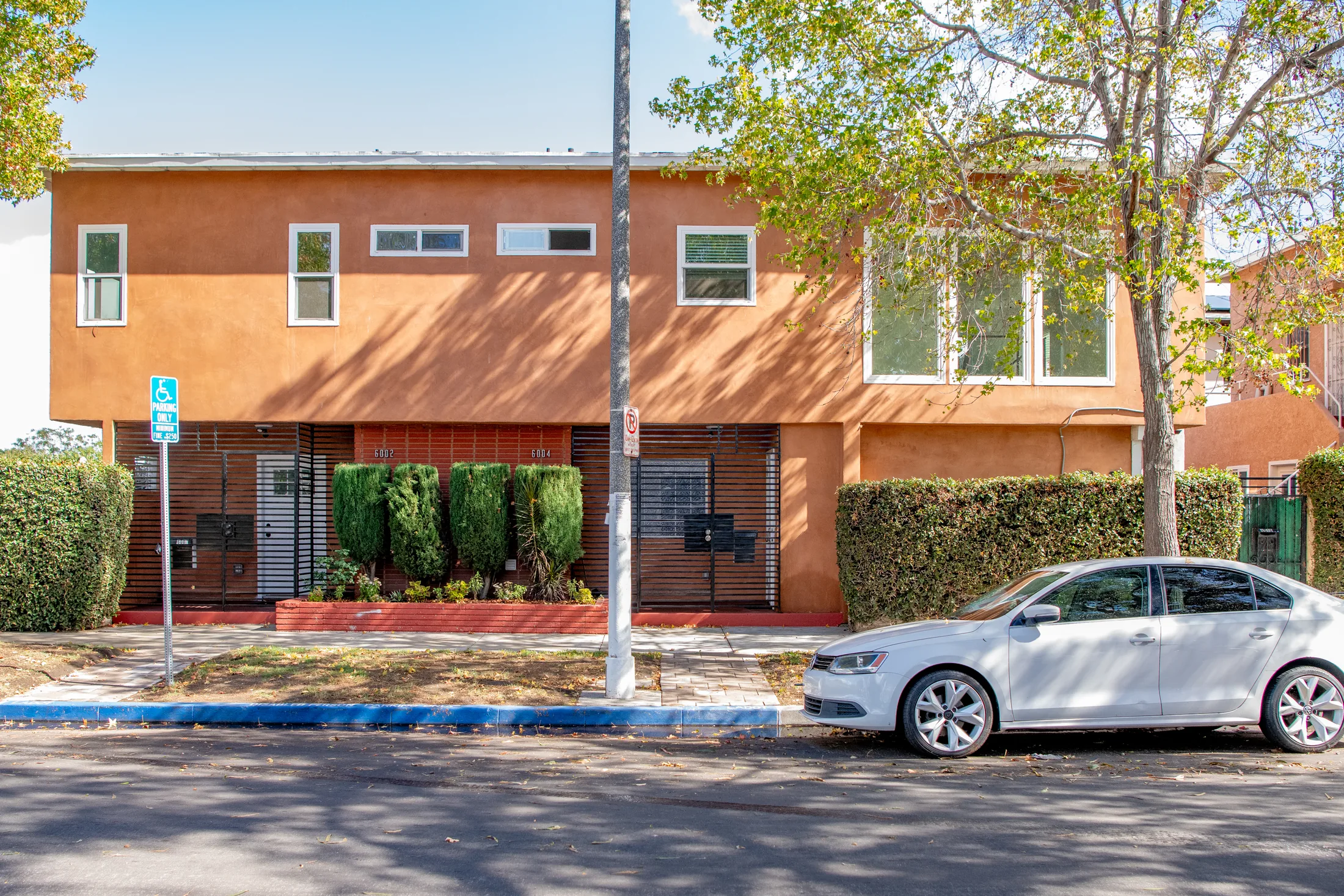 Exterior of the two-story duplex at 6004-6004½ S Denker