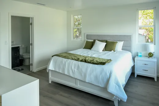 Bedroom with a window and a doorway into the en-suite bathroom