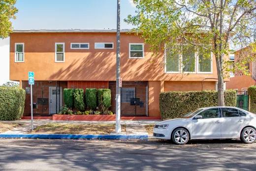 Street view of the terracotta two-story duplex at 6004-6004½ S Denker