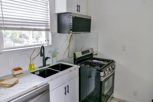 Kitchen detail showing cabinetry, counter, and range